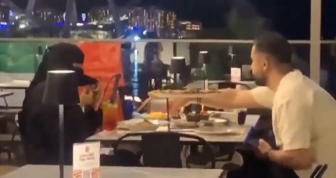 mocking woman hijab Dubai